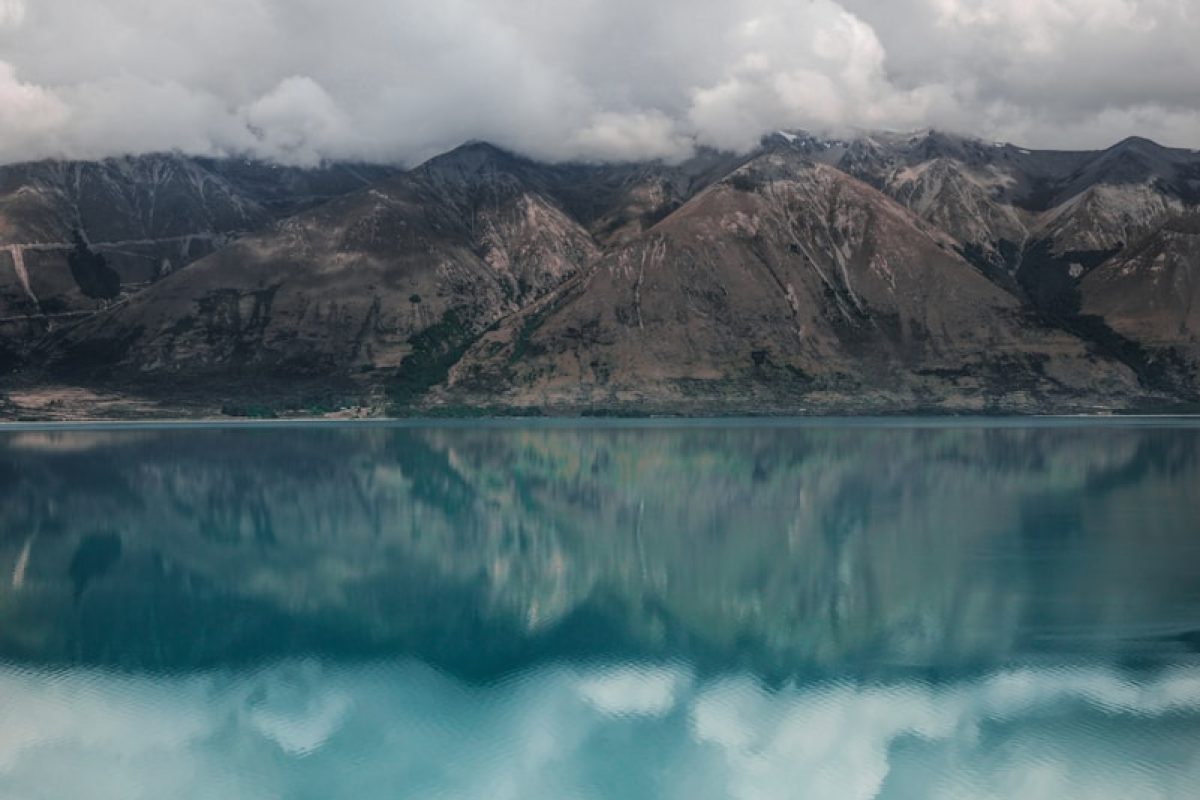 body of water under white cloids