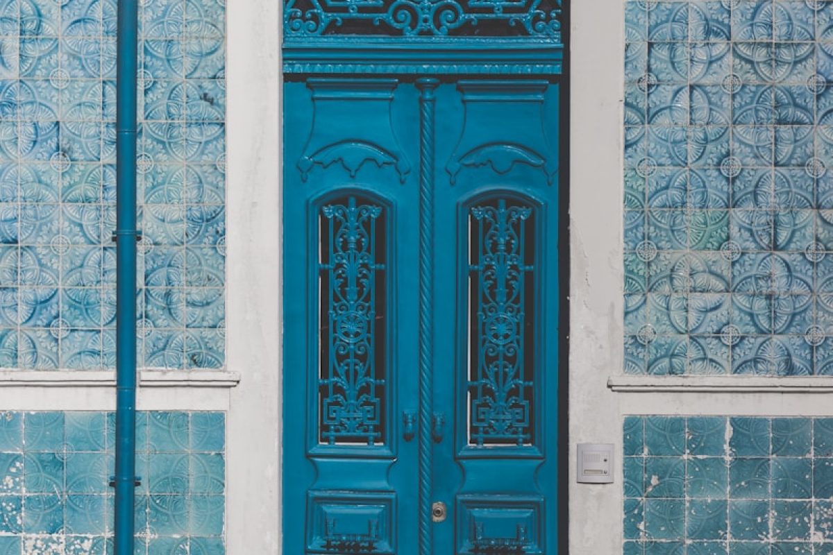 blue wooden door closed with 46 sign