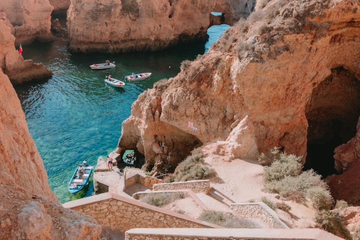three boats on body of water
