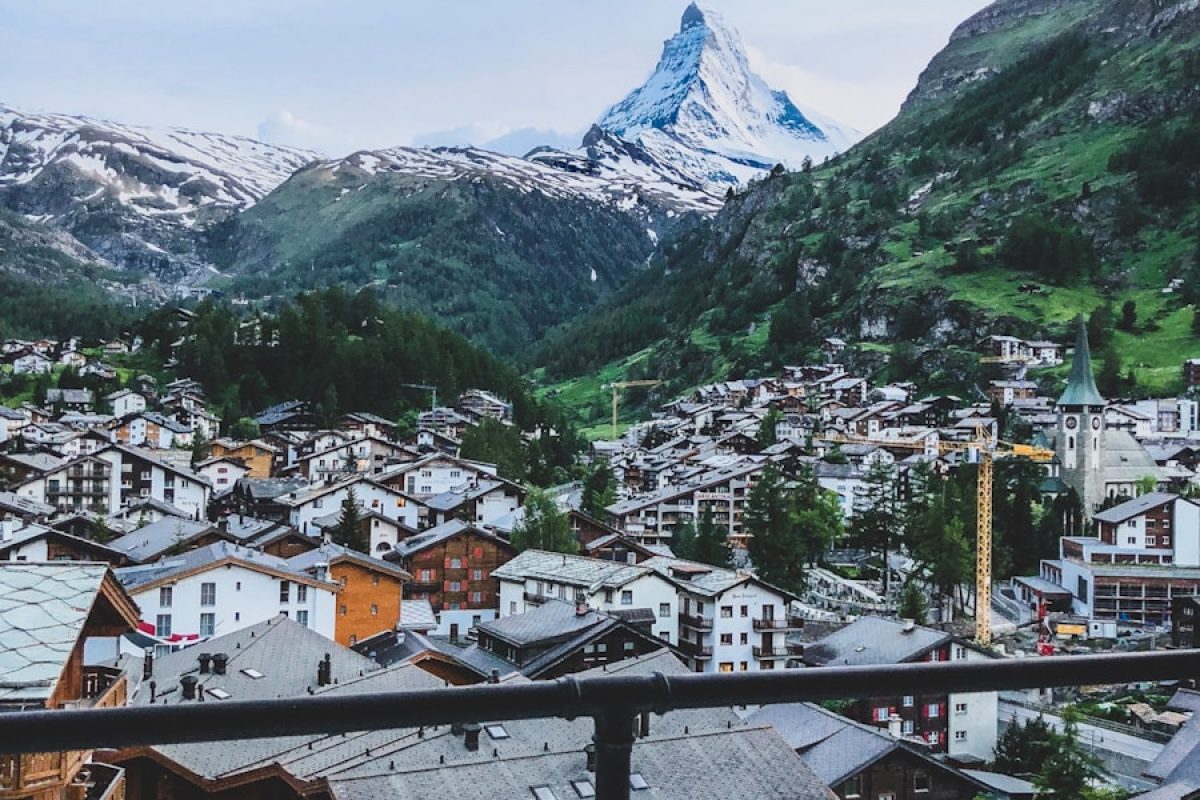 aerial photography of houses near mountains at daytime