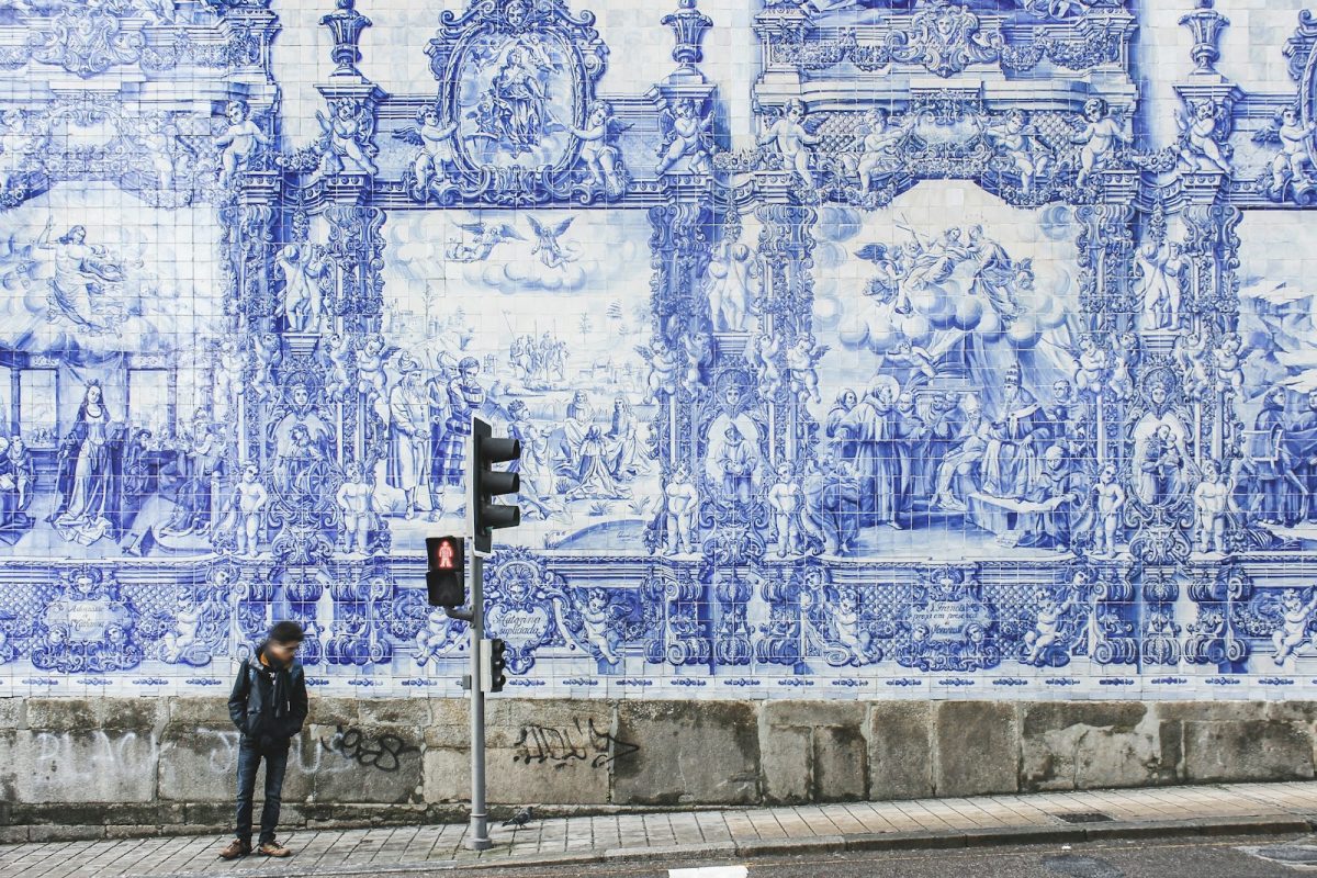 man standing near traffic lights