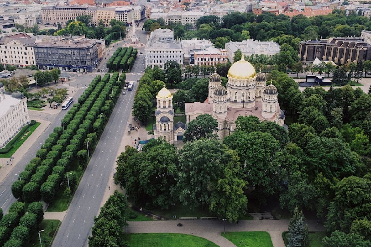 aerial view of city with garden and dome building
